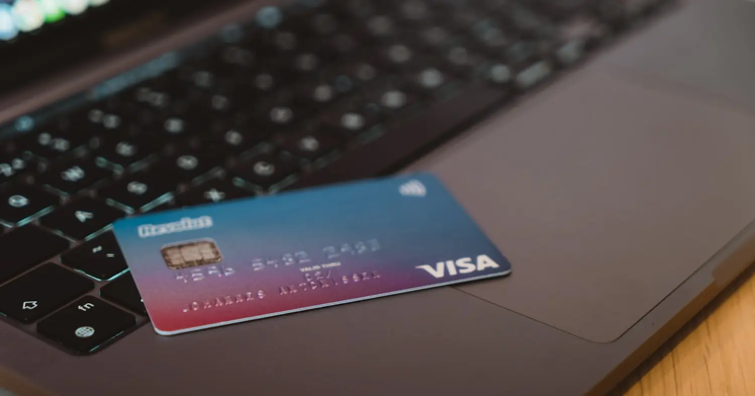 Bank card resting on a laptop